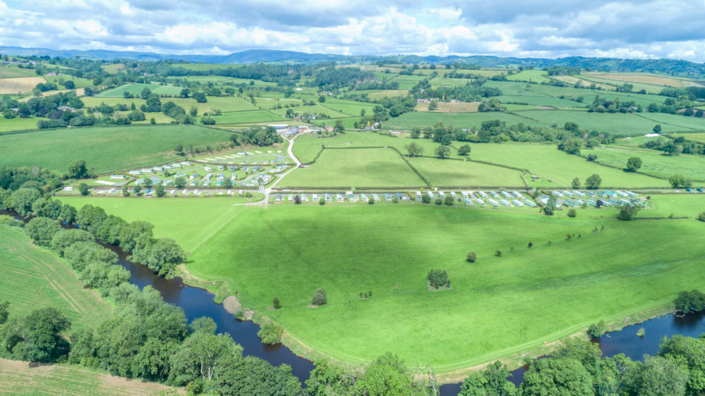 Aerial shot of the park surrounded with the Welsh Countryside and River